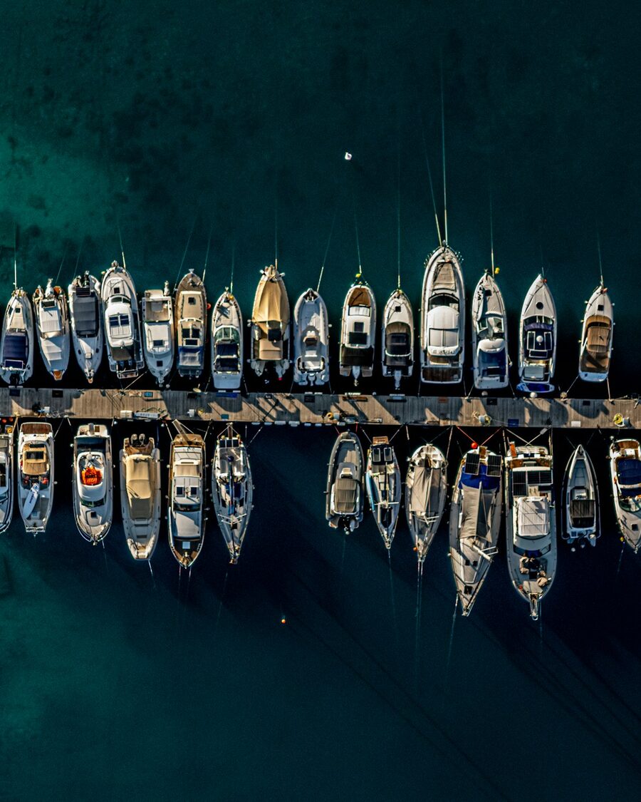 Aerial view of motor yachts berthed in a marina