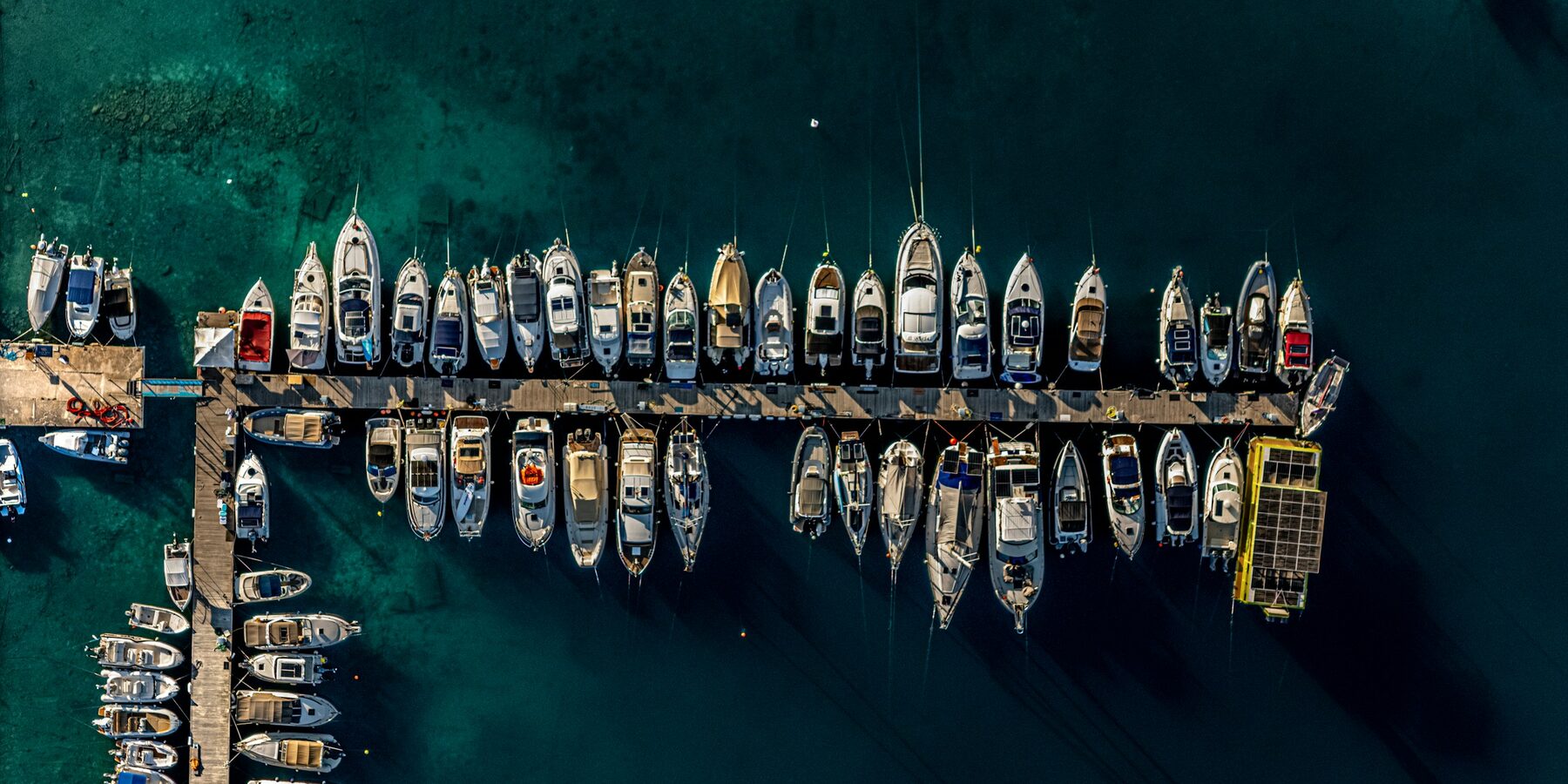 Aerial view of motor yachts berthed in a marina
